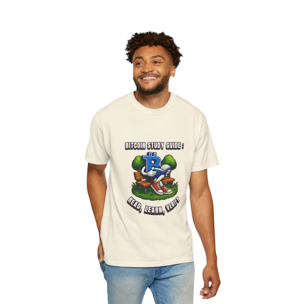 Man wearing an Ivory T-Shirt with a blue Bitcoin character reading a book on a bench, surrounded by trees and "BITCOIN STUDY GUIDE" lettering.